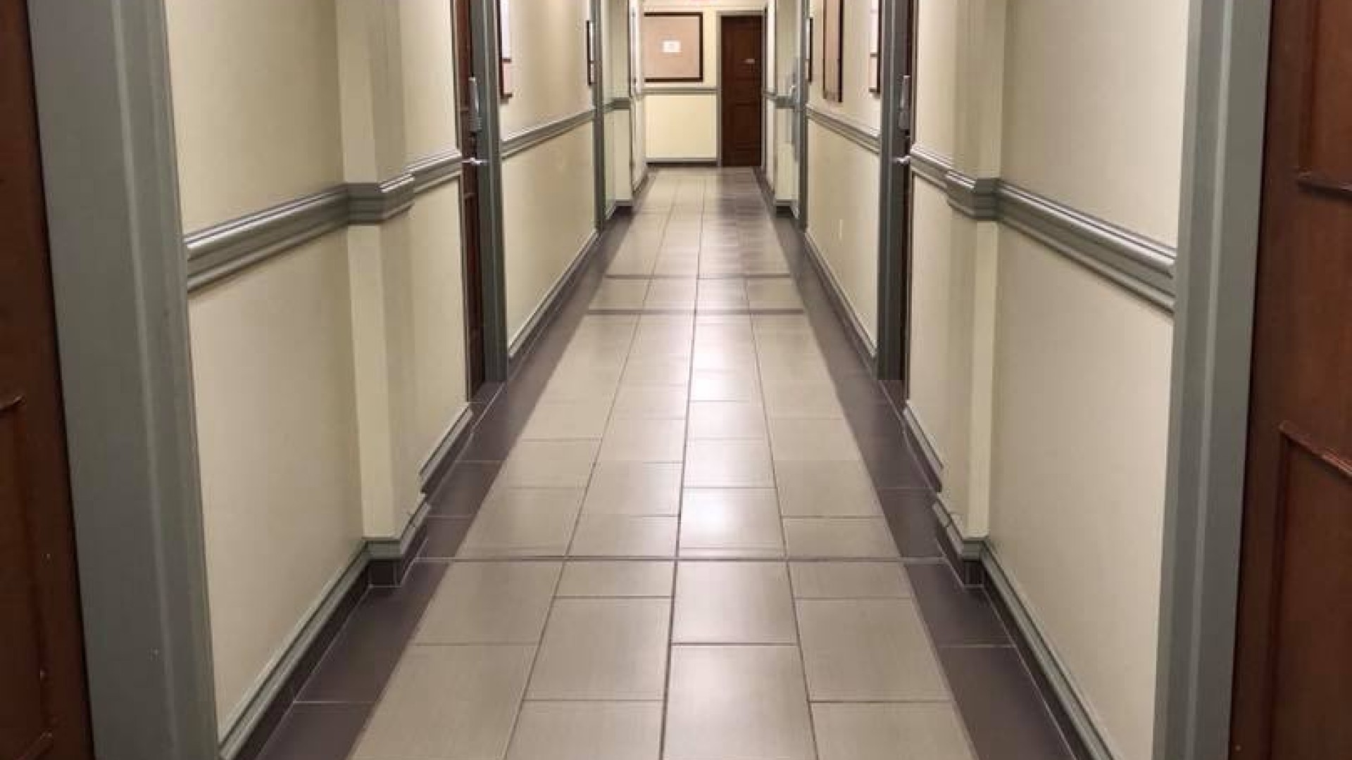 Hallway with dorm rooms along each side 