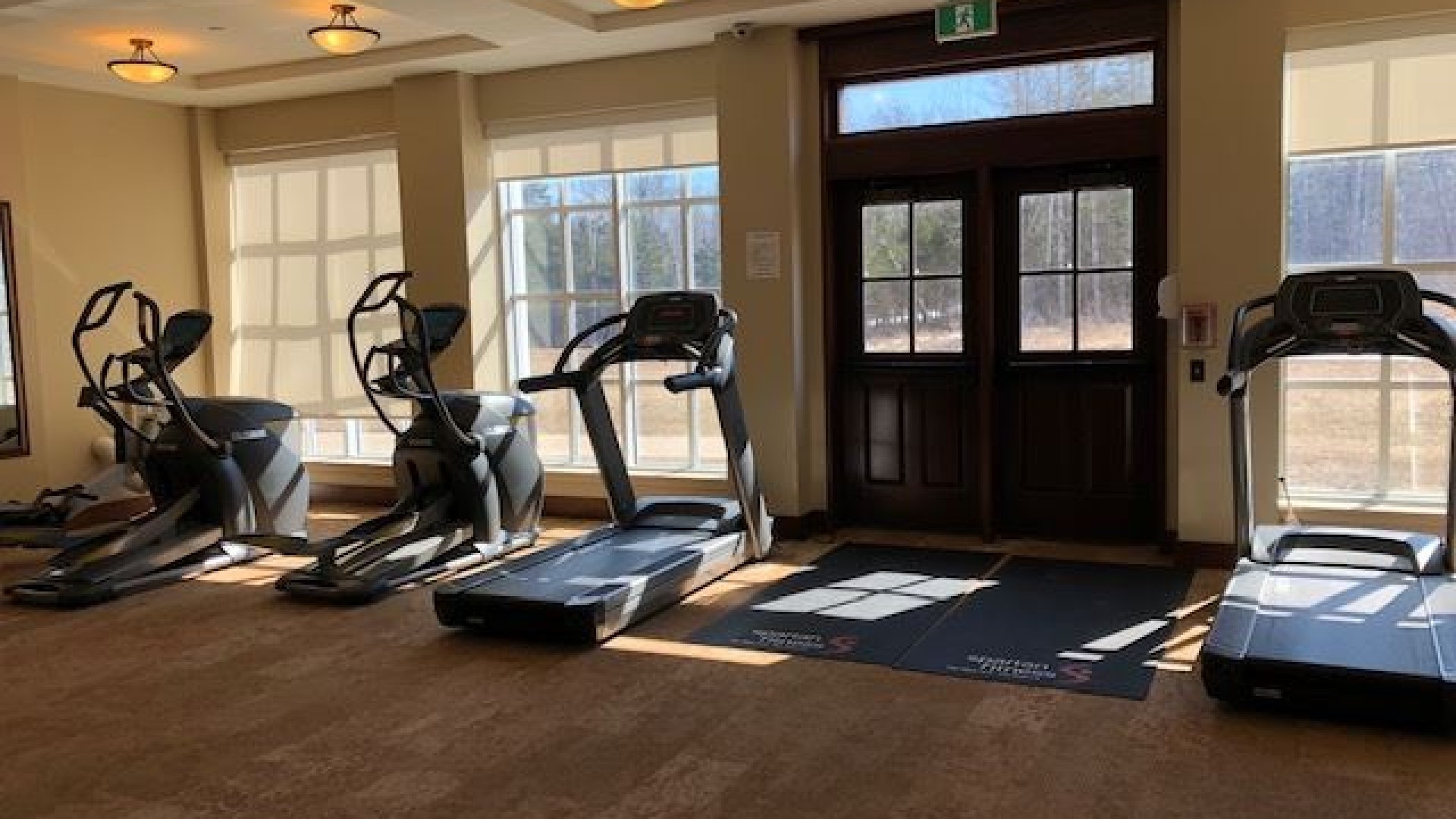 Cardio room with treadmills and large windows 