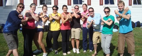 Students of StFX doing an X sign with their arms