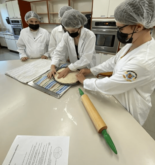 Students Learning About Fractions Using Pizzas