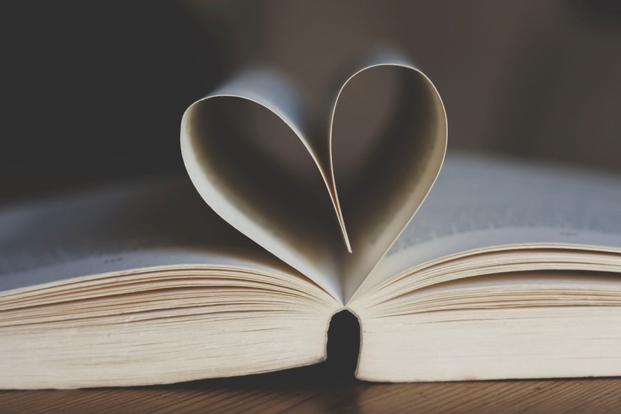 Open book with pages folded in the shape of a heart