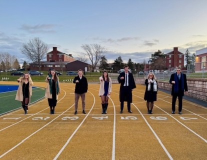 The Brennan Family showing their X-Rings on the running track