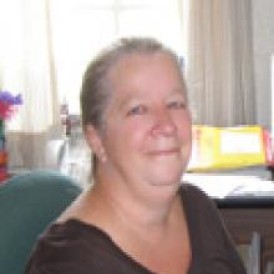 Headshot of woman smiling.